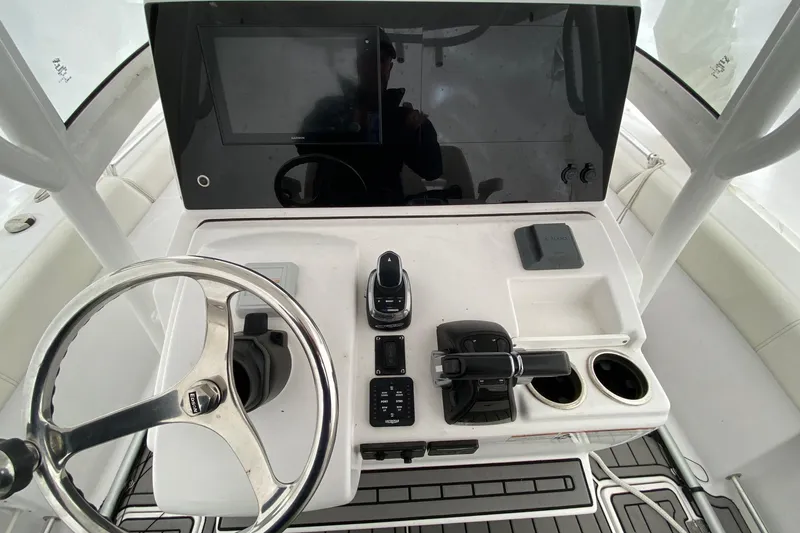 Slide: The Image of 2020 Sportsman Open 282 Center Console dashboard with steering wheel and controls. - 7