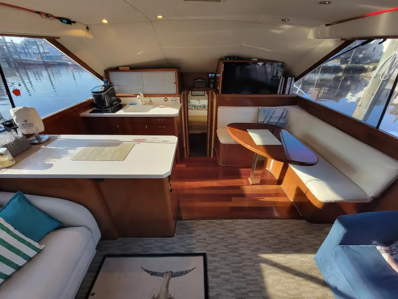 Slide: The Image of Interior of 1991 Ocean Yachts 42 Super Sport with modern kitchen and cozy seating area. - 10