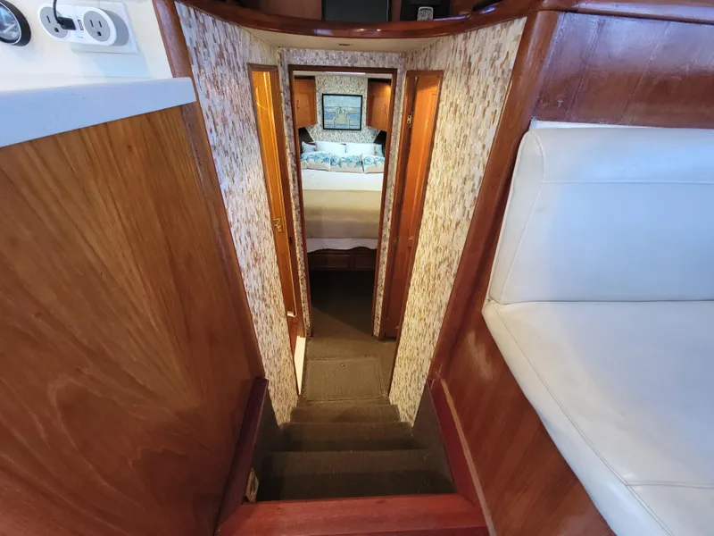 Slide: The Image of Stairway leading to bedroom in 1991 Ocean Yachts 42 Super Sport. - 14