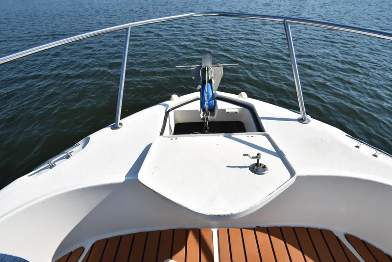 Slide: The Image of Bow view of 2007 Shamrock 246 Adventurer on the water. - 19