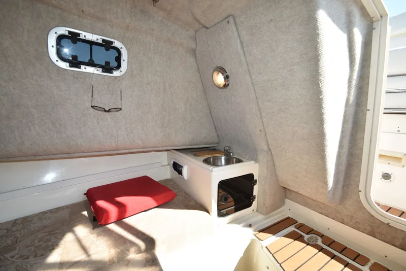 Slide: The Image of Interior of 2007 Shamrock 246 Adventurer with kitchenette and window. - 27