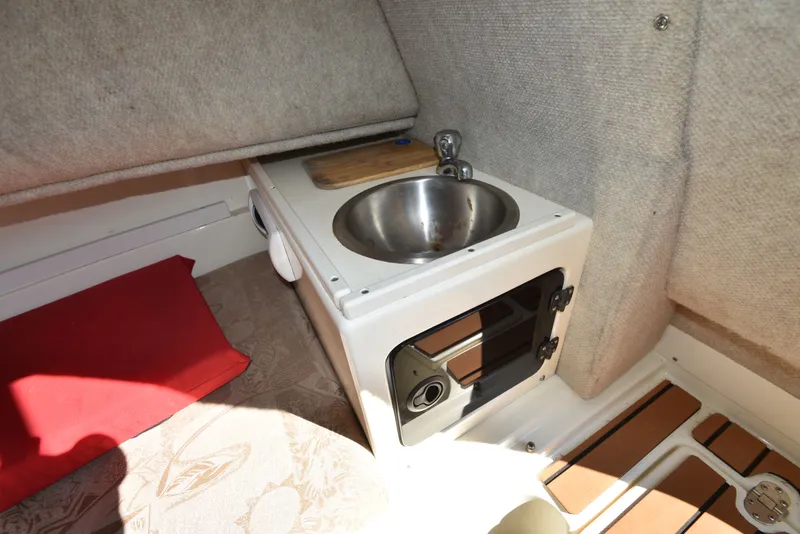 Slide: The Image of Interior of 2007 Shamrock 246 Adventurer with sink and oven. - 29
