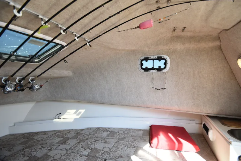 Slide: The Image of Interior of 2007 Shamrock 246 Adventurer with fishing rod holders. - 31