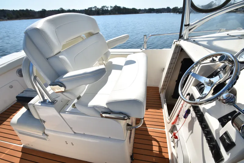 Slide: The Image of Interior of a 2007 Shamrock 246 Adventurer boat with helm station. - 40
