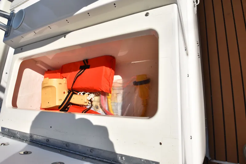 Slide: The Image of Safety equipment in a 2007 Shamrock 246 Adventurer boat. - 45