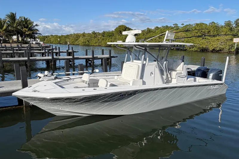 The Image of 2025 SeaHunter 30 Floridian boat docked in a scenic marina setting. - 1