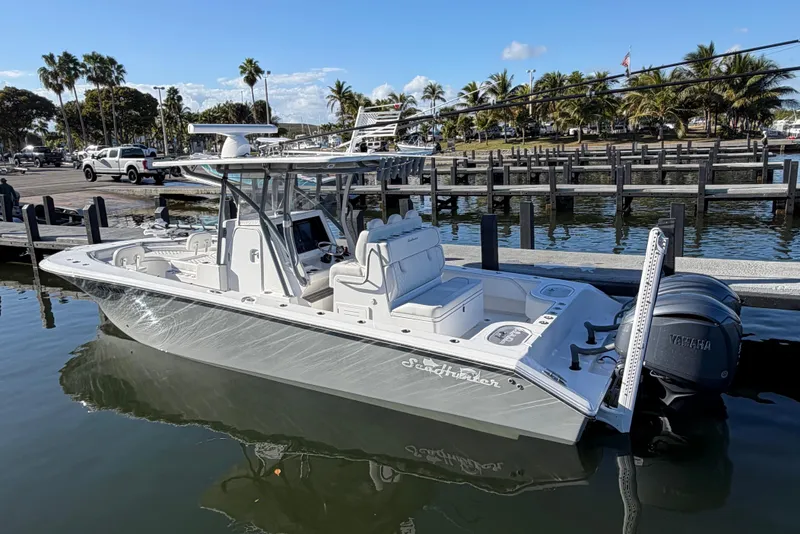 Slide: The Image of 2025 SeaHunter 30 Floridian boat docked, featuring sleek design and Yamaha engines. - 3