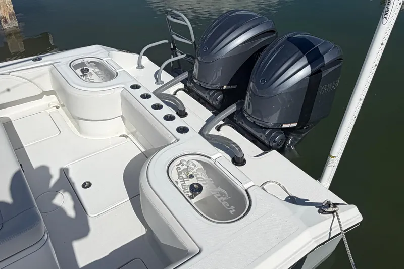Slide: The Image of 2025 SeaHunter 30 Floridian boat with dual outboard engines and spacious deck layout. - 5