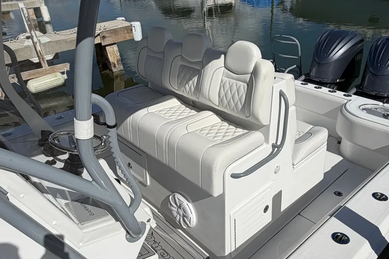 Slide: The Image of 2025 SeaHunter 30 Floridian boat interior with luxurious white seating and modern design. - 6