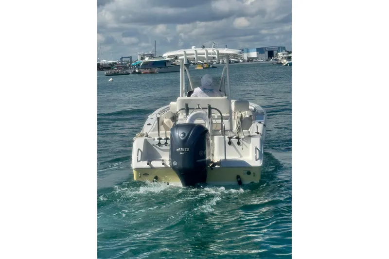 Slide: The Image of 2013 Sea Hunt Ultra 234 boat cruising on a sunny day with Yamaha 250 engine. - 10