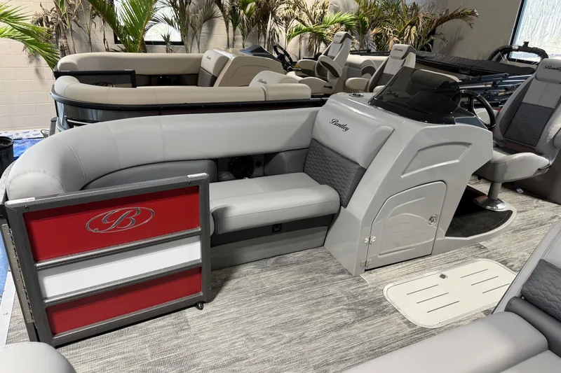 The Image of 2026 Bentley Pontoons Elite 223 Admiral interior with gray seating and modern helm. - 1