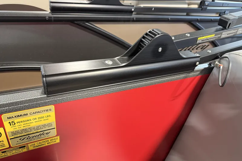 Slide: The Image of 2026 Bentley Pontoons Elite 223 Admiral, interior detail with capacity label and sleek design. - 10