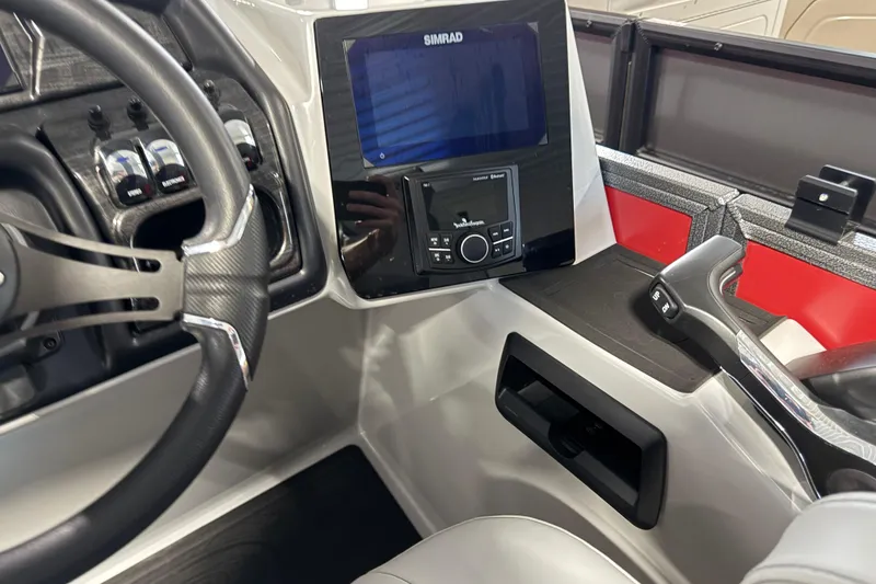 Slide: The Image of 2026 Bentley Pontoons Elite 223 Admiral dashboard with steering wheel and control panel. - 11