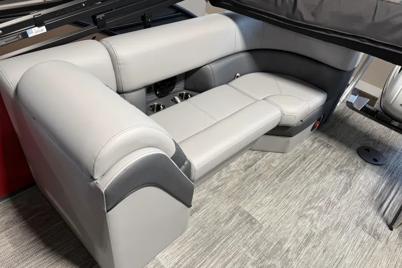 Slide: The Image of 2026 Bentley Pontoons Elite 223 Admiral interior seating with gray upholstery and cup holders. - 12