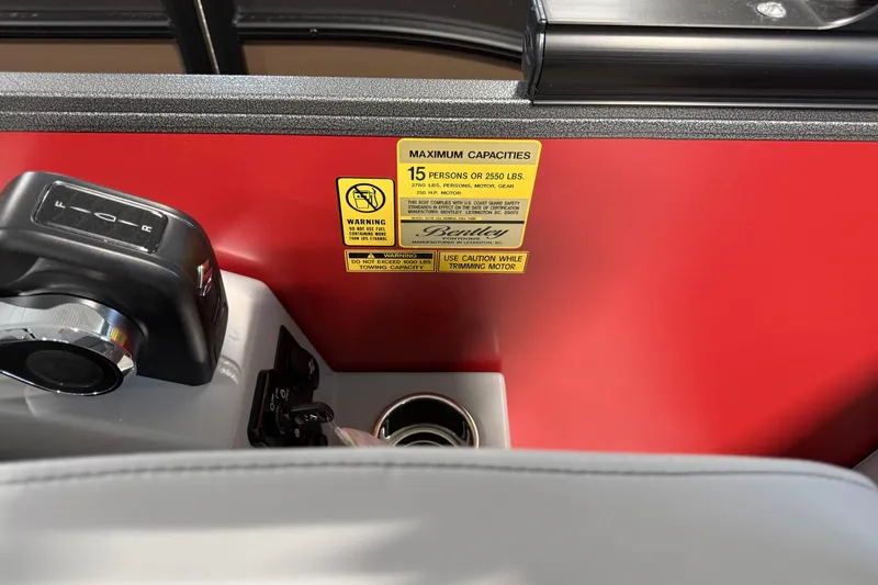 Slide: The Image of Control panel of 2026 Bentley Pontoons Elite 223 Admiral with capacity warning label. - 9