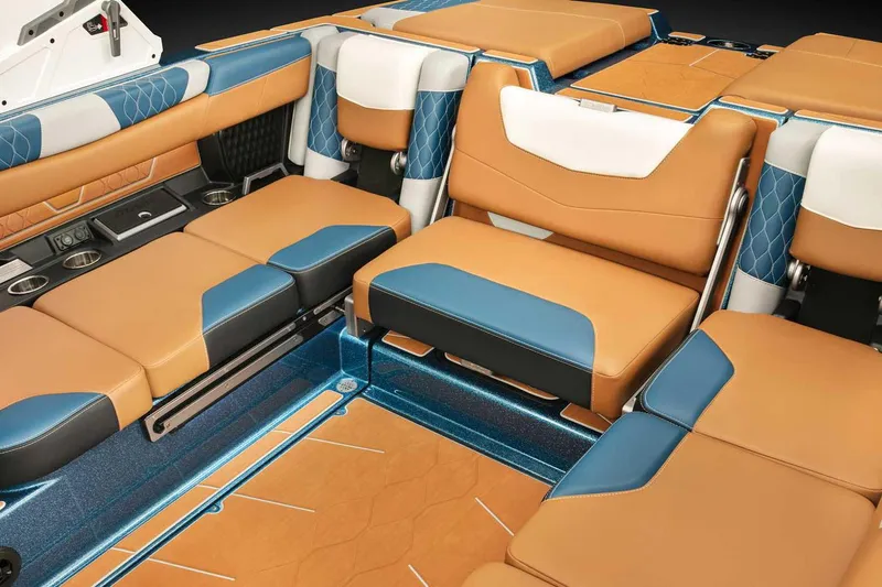 Slide: The Image of 2022 Malibu M220 boat with Surf Gate technology, rear view in parking lot. - 11