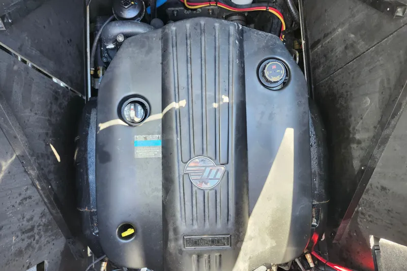 Slide: The Image of 2022 Malibu M220 engine compartment with visible components and wiring. - 19