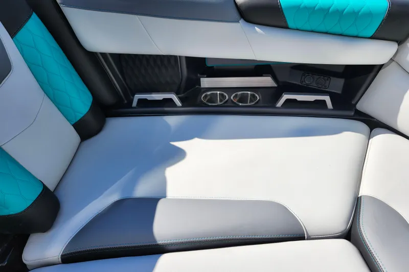 Slide: The Image of 2022 Malibu M220 interior with teal and gray upholstery, featuring cup holders and modern design. - 45
