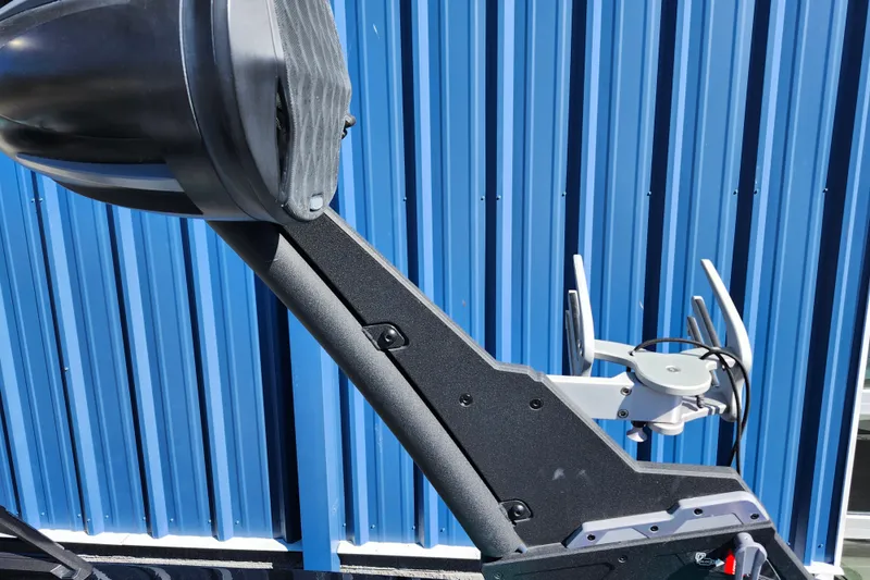 Slide: The Image of Close-up of 2022 Malibu M220 boat tower against blue metal wall. - 53