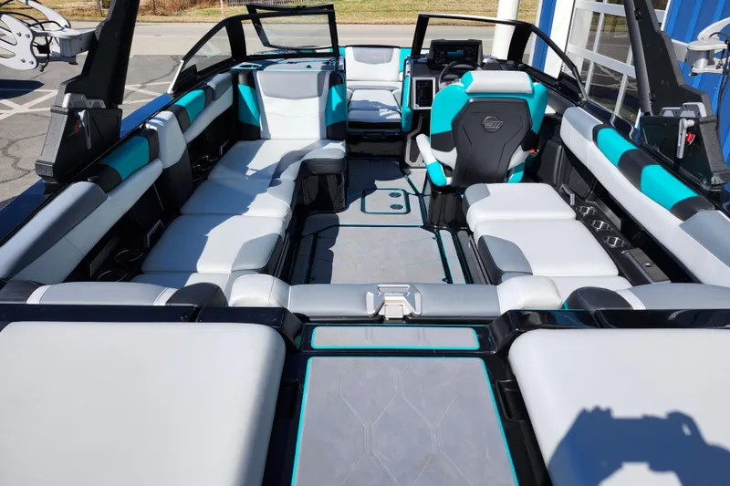 Slide: The Image of 2022 Malibu M220 boat interior with modern seating and sleek design. - 58