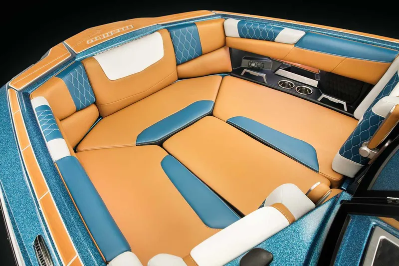 Slide: The Image of Manufacturer Provided Image: 2022 Malibu M220 boat interior with blue and tan upholstery. - 64