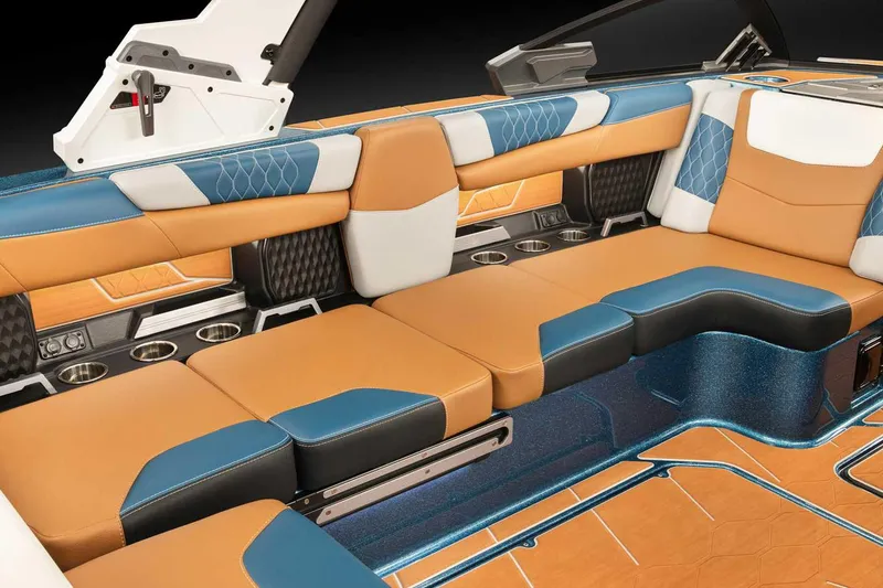 Slide: The Image of Manufacturer Provided Image: 2022 Malibu M220 boat interior with luxurious tan, blue, and white seating. - 69