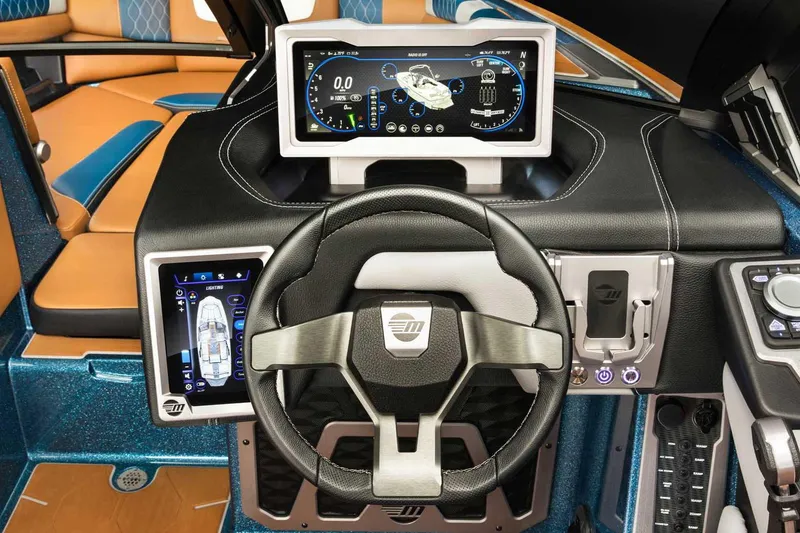 Slide: The Image of Rear view of a 2022 Malibu M220 boat with propeller and wakeboard features. - 8