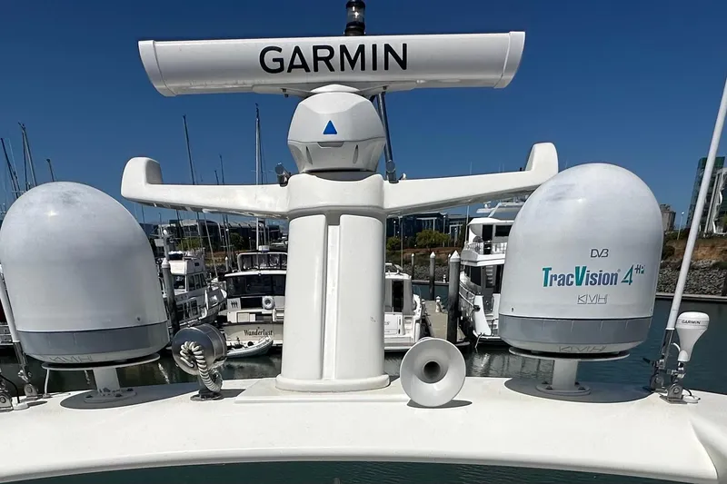 Slide: The Image of Radar and satellite equipment on a 2006 Ferretti Yachts 550, docked in a marina. - 10
