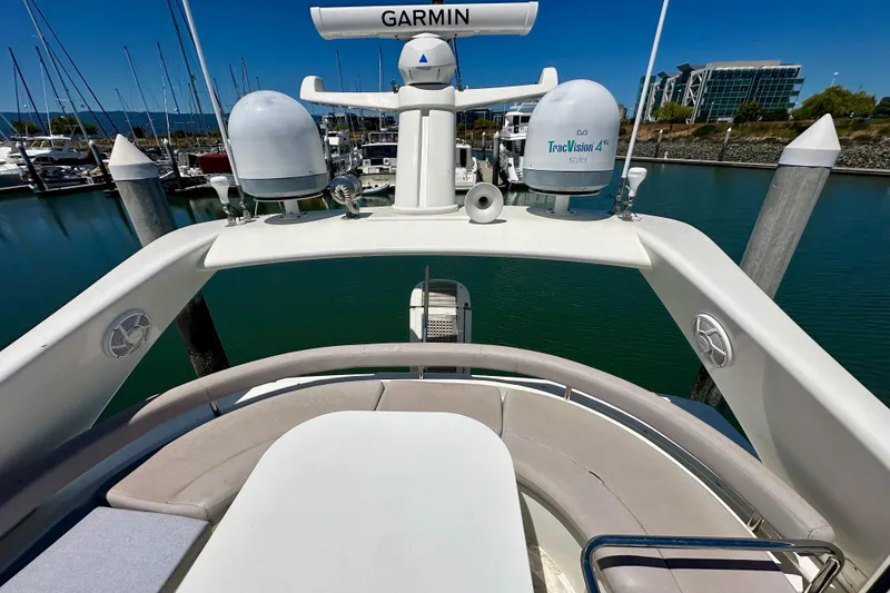 Slide: The Image of 2006 Ferretti Yachts 550 flybridge with Garmin and TracVision equipment, docked in marina. - 12