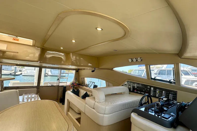 Slide: The Image of Luxurious interior of 2006 Ferretti Yachts 550 with helm and seating area. - 16