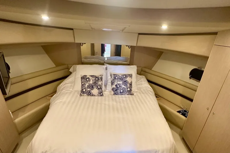 Slide: The Image of Luxurious bedroom interior of 2006 Ferretti Yachts 550 with elegant bedding and ambient lighting. - 17