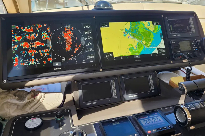 Slide: The Image of Cockpit of 2006 Ferretti Yachts 550 with advanced Garmin navigation displays. - 19