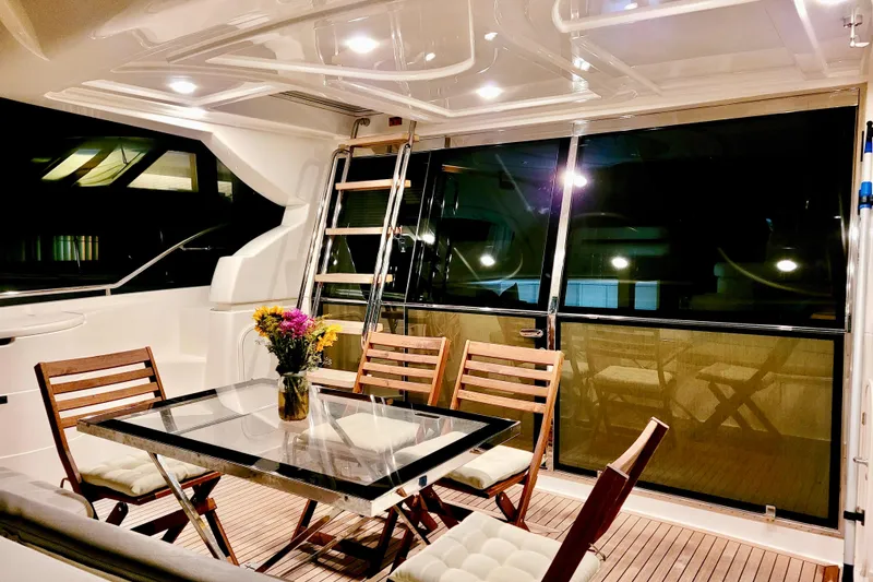 Slide: The Image of Luxurious 2006 Ferretti Yachts 550 interior with elegant dining area and modern decor. - 2