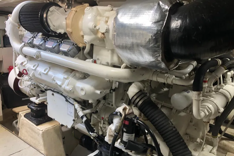 Slide: The Image of Engine room of a 2006 Ferretti Yachts 550, showcasing a powerful marine engine. - 25