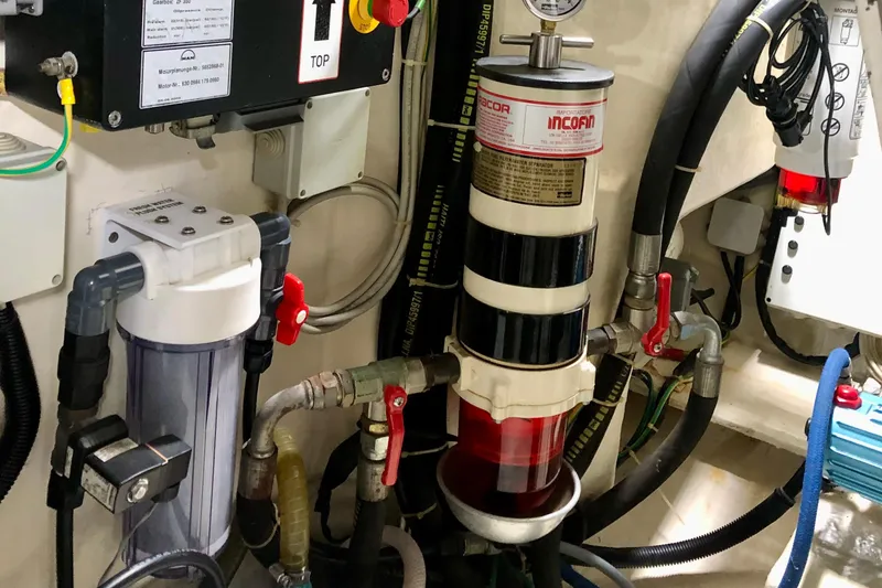 Slide: The Image of Engine room of 2006 Ferretti Yachts 550, showcasing fuel filtration system and components. - 27