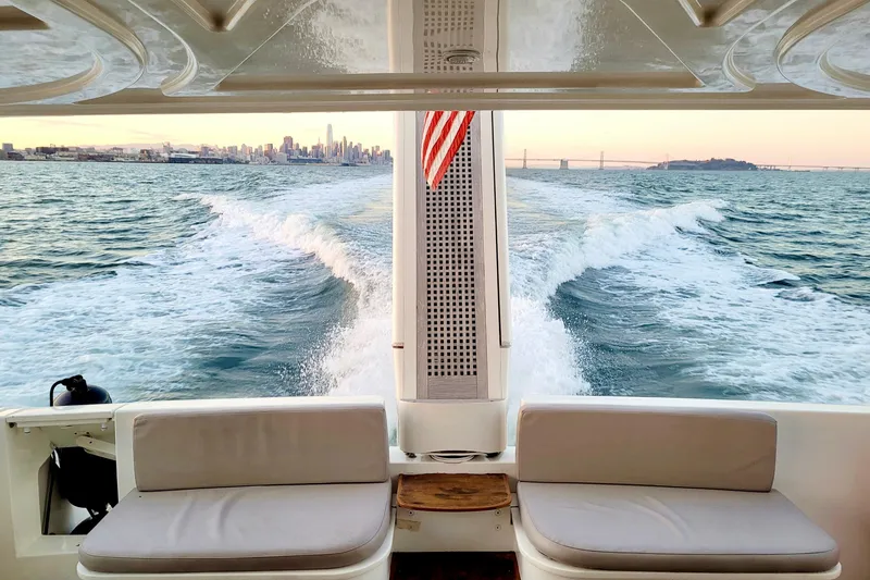 Slide: The Image of Ferretti Yachts 550 cruising with city skyline and bridge in the background, 2006 model. - 29