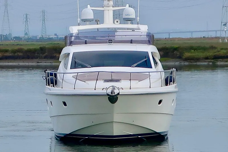 Slide: The Image of Front view of a 2006 Ferretti Yachts 550 on calm water. - 6