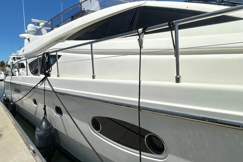 Slide: The Image of 2006 Ferretti Yachts 550 docked, showcasing sleek design and luxury features. - 9