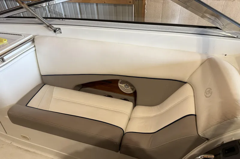 Slide: The Image of 1998 Cobalt 293 boat interior with beige seating and speaker detail. - 18