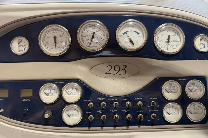 Slide: The Image of Dashboard of a 1998 Cobalt 293 boat with gauges and controls. - 23