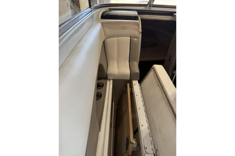 Slide: The Image of Interior of a 1998 Cobalt 293 boat showing seating and storage area. - 25