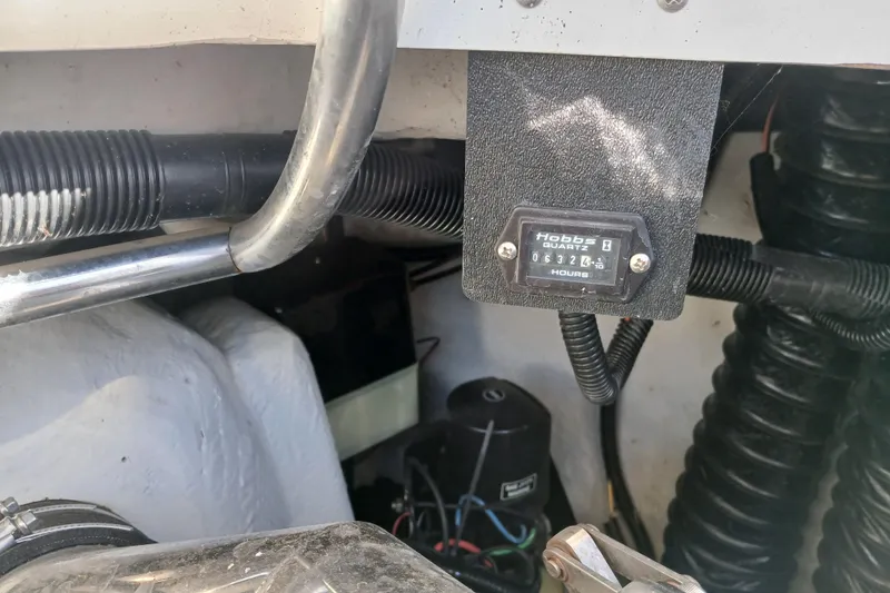 Slide: The Image of Engine compartment of a 1998 Cobalt 293 with Hobbs hour meter reading 632.4 hours. - 40