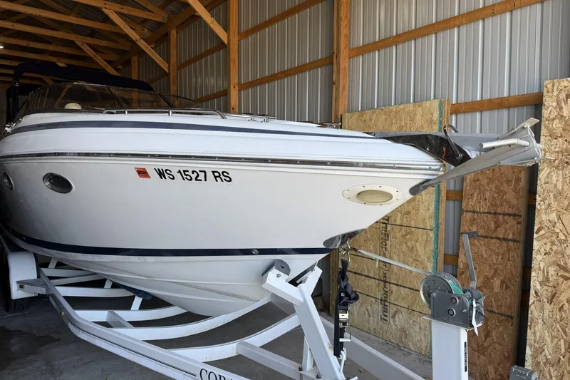 Slide: The Image of 1998 Cobalt 293 boat on trailer in storage shed. - 5