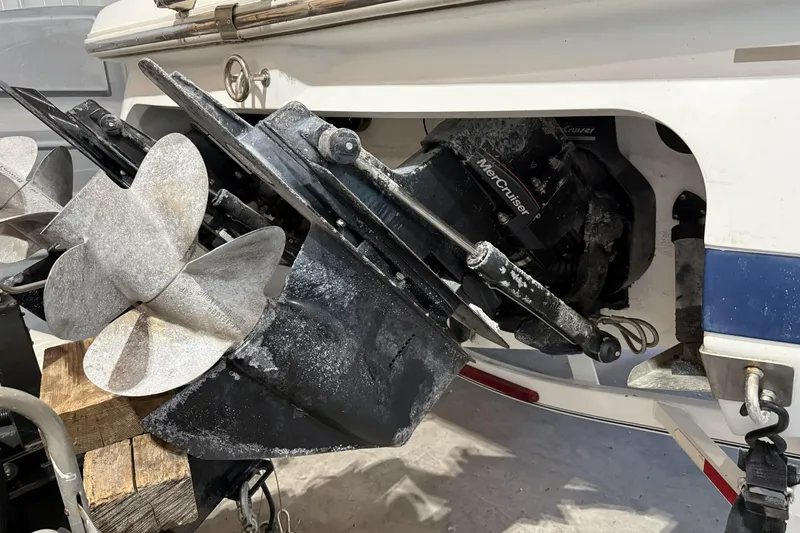 Slide: The Image of 1998 Cobalt 293 boat with MerCruiser outdrive and propeller, showing wear and corrosion. - 9