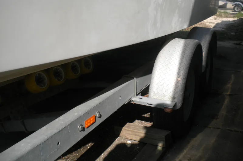 Slide: The Image of Trailer for 2009 Maxum 2700 SE boat with dual wheels and rollers. - 22