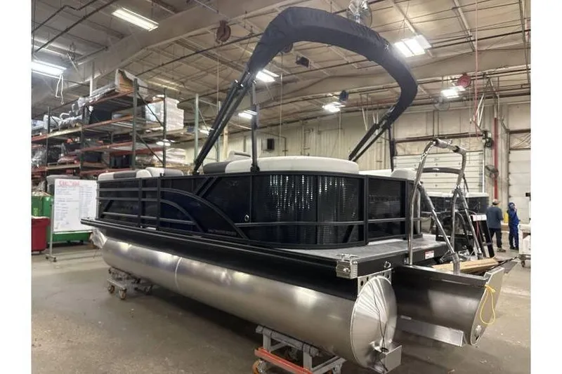 Slide: The Image of 2026 Bennington 20 SSR Quad Bench Tritoon with Yamaha 115 HP in warehouse setting. - 11