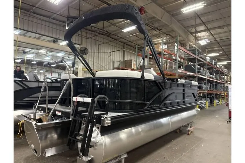 Slide: The Image of 2026 Bennington 20 SSR Quad Bench Tritoon with Yamaha 115 HP in stock, warehouse setting. - 12