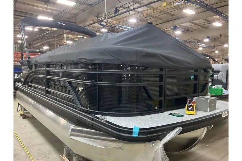 Slide: The Image of 2026 Bennington 20 SSR Quad Bench Tritoon with Yamaha 115 HP, covered in a warehouse. - 15