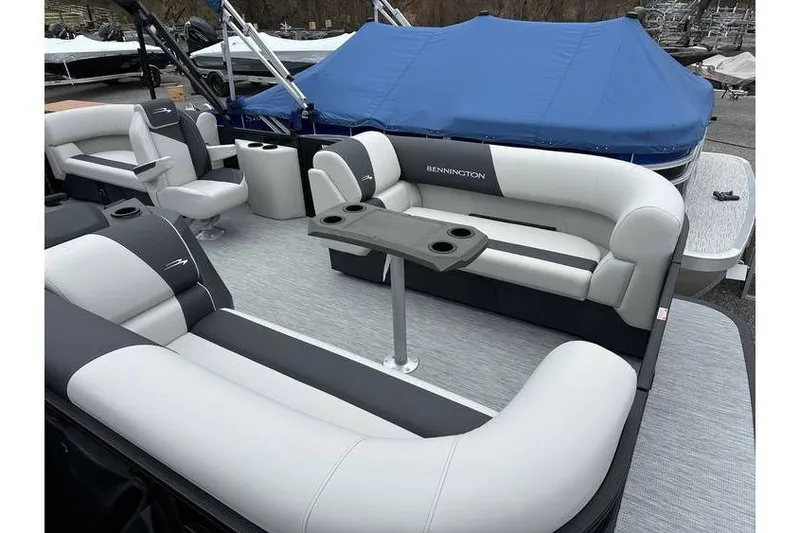 Slide: The Image of 2026 Bennington 20 SSR Quad Bench Tritoon with Yamaha 115 HP, featuring spacious seating and table. - 18