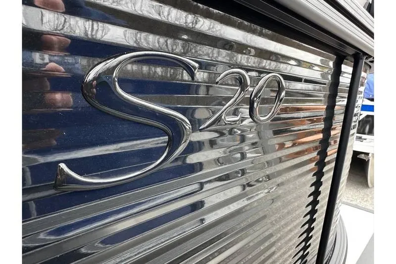 Slide: The Image of Close-up of Bennington 20 SSR Tritoon's metallic "S 20" emblem, 2026 model. - 33